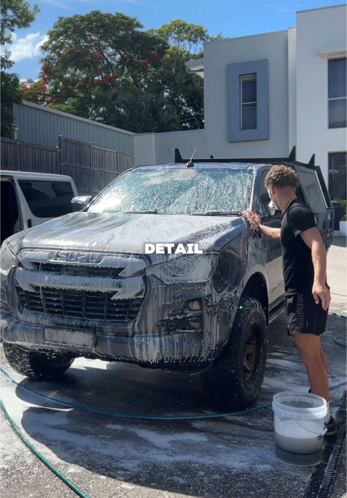 Beau foam-washing a customer Isuzu D-Max